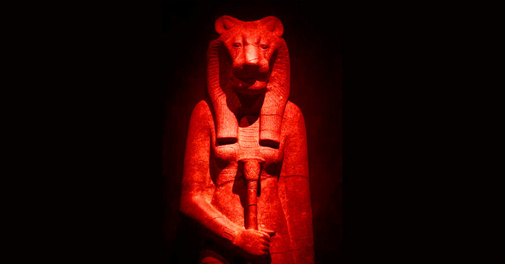 a red image of an Egyptian goddess illustrates the idea of female initiations.