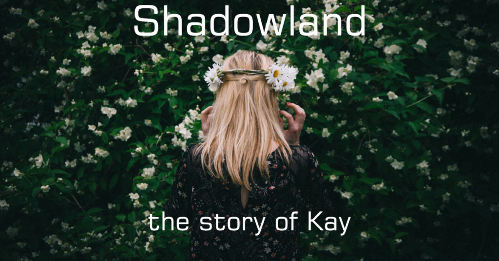 A woman with blond hair faces away from the camera. She has a daisy chain in her hair. She represents Kay's prostitution story.
