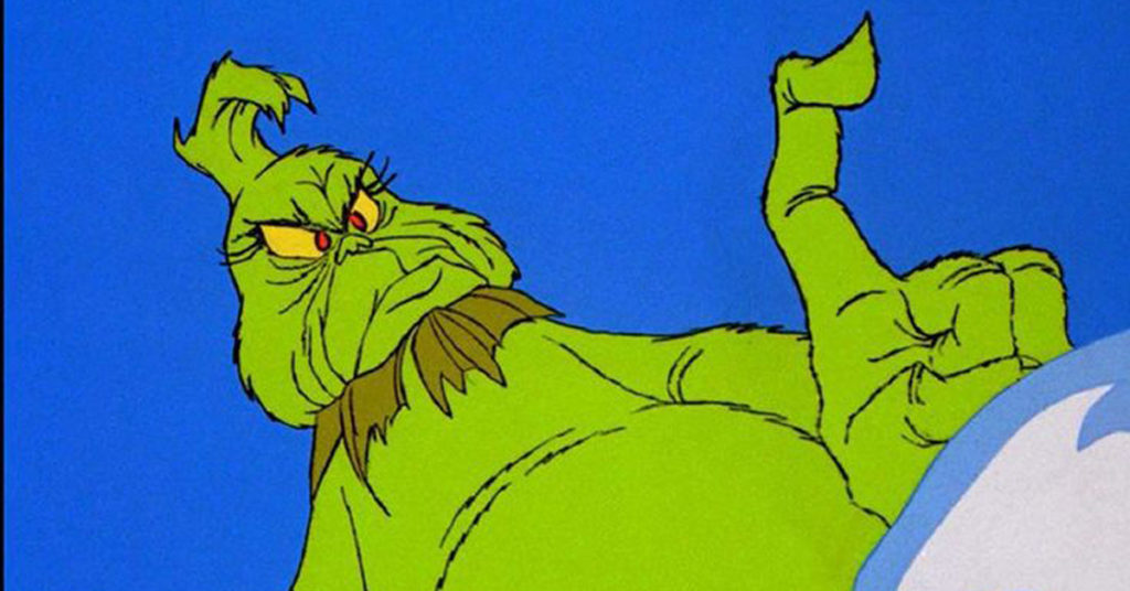 the grinch is shown wagging his finger.