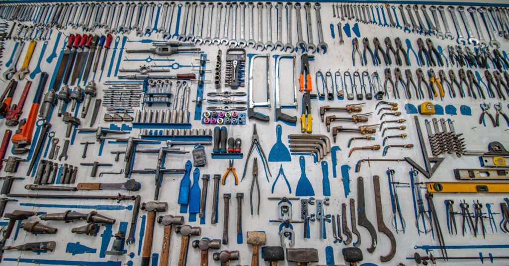 Tool are laid out neatly on a workbench, illustrating the compulsive behavior associated with OCD. 